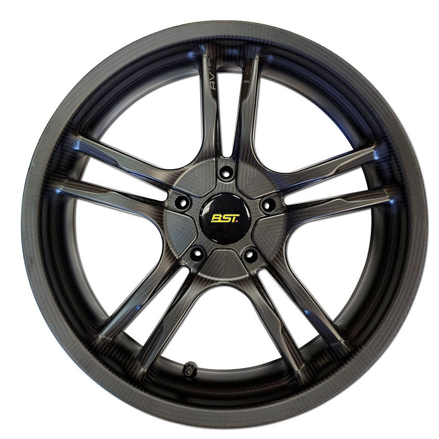 Car wheel rim with 'EST' branding on a white background