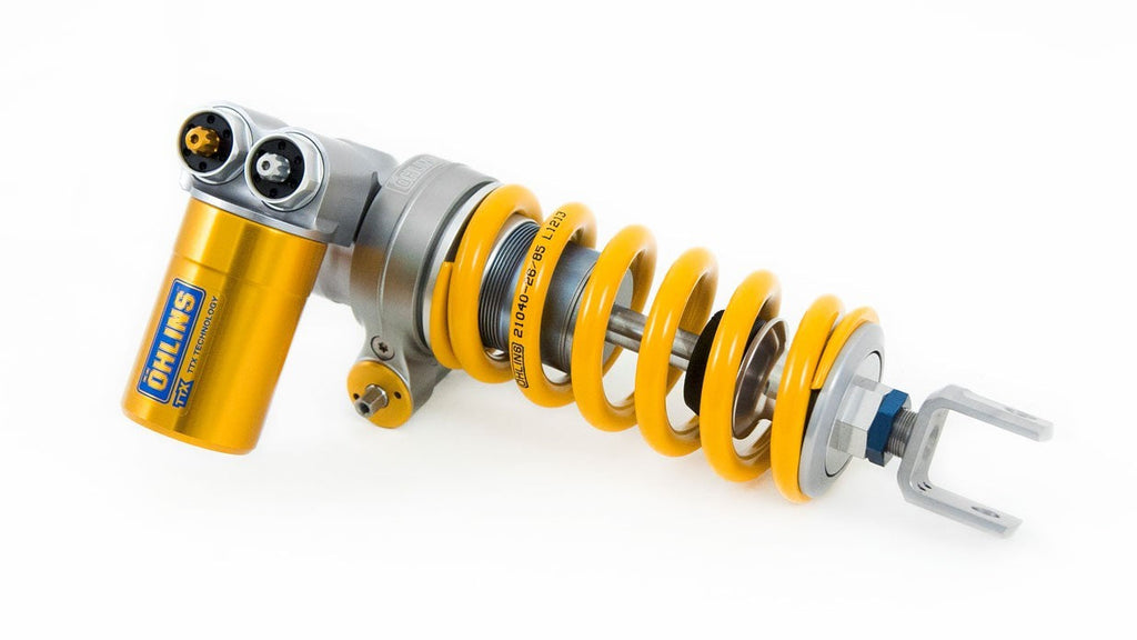 Yellow shock absorber with branding on a white background