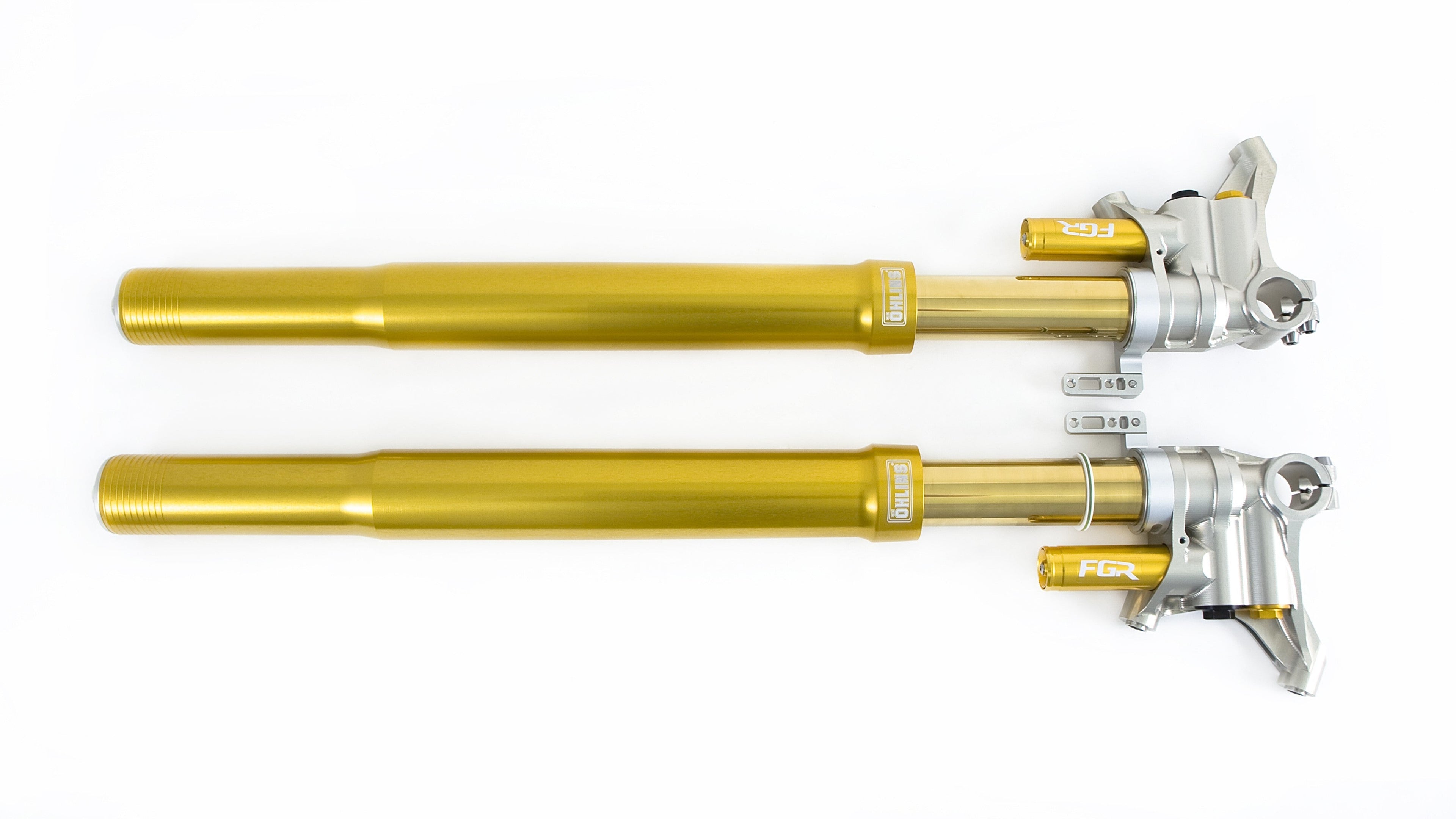 Pair of gold motorcycle forks on a white background