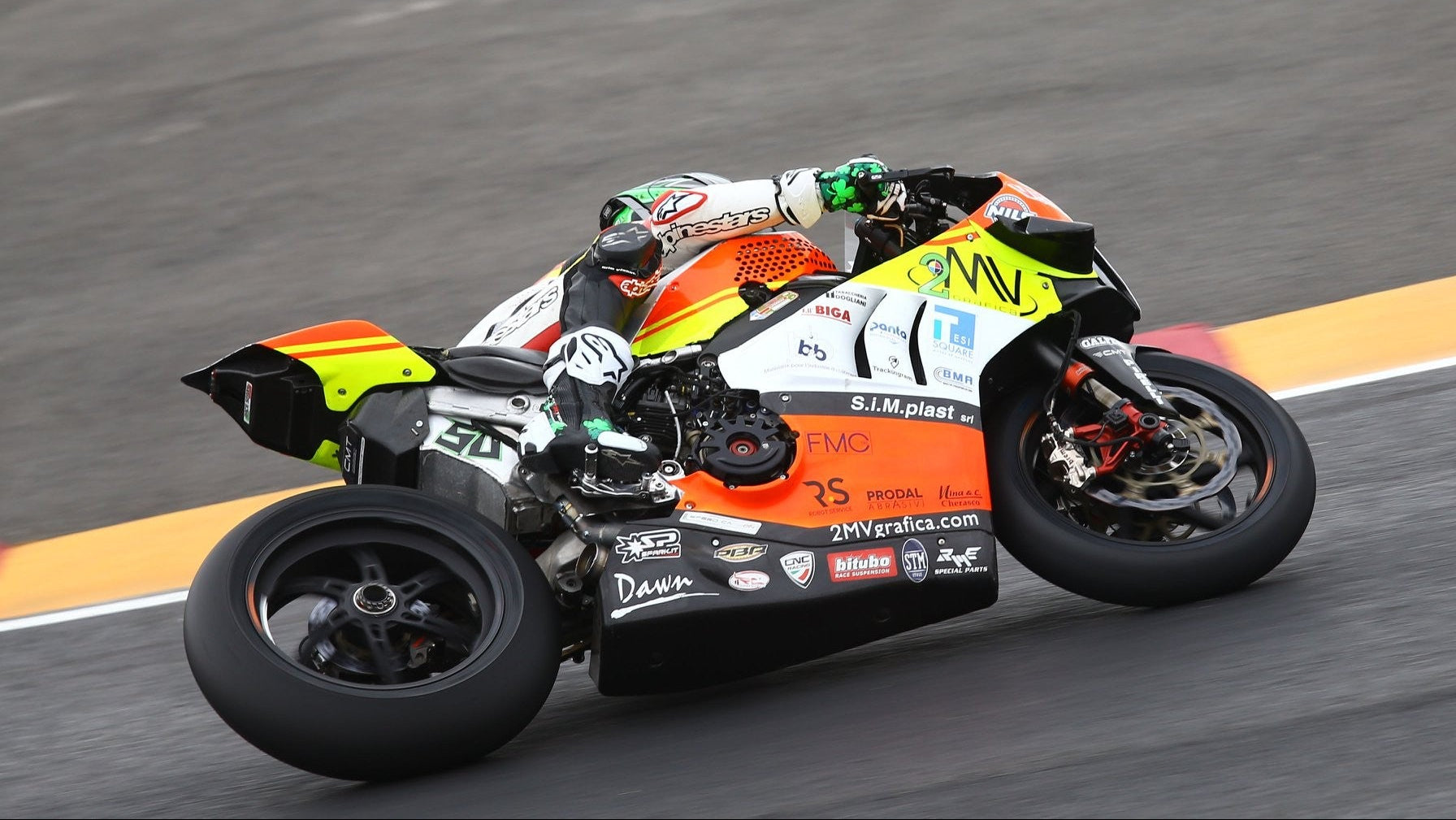 Racing motorcycle on a track with visible branding and sponsor logos.