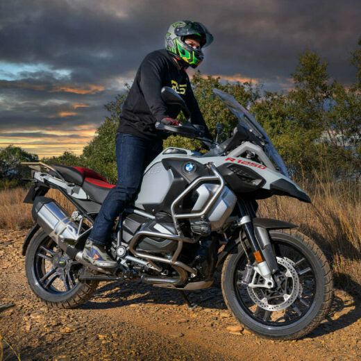 Person on a BMW motorcycle with a scenic background