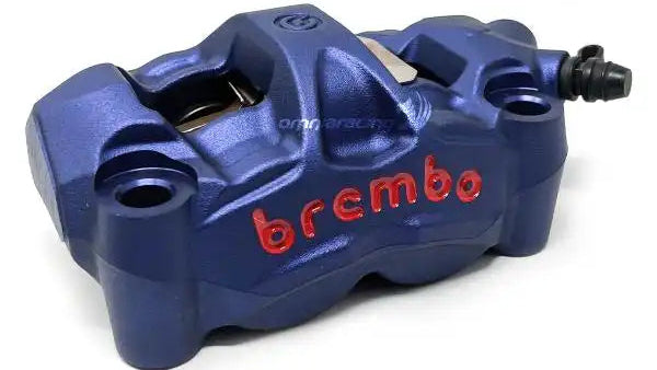 Blue Brembo brake caliper on a white background