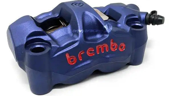 Blue Brembo brake caliper on a white background