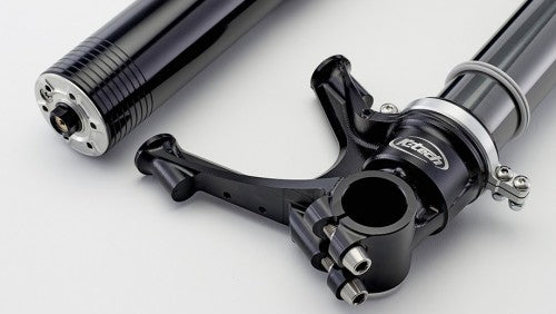 Close-up of a motorcycle suspension fork on a white background