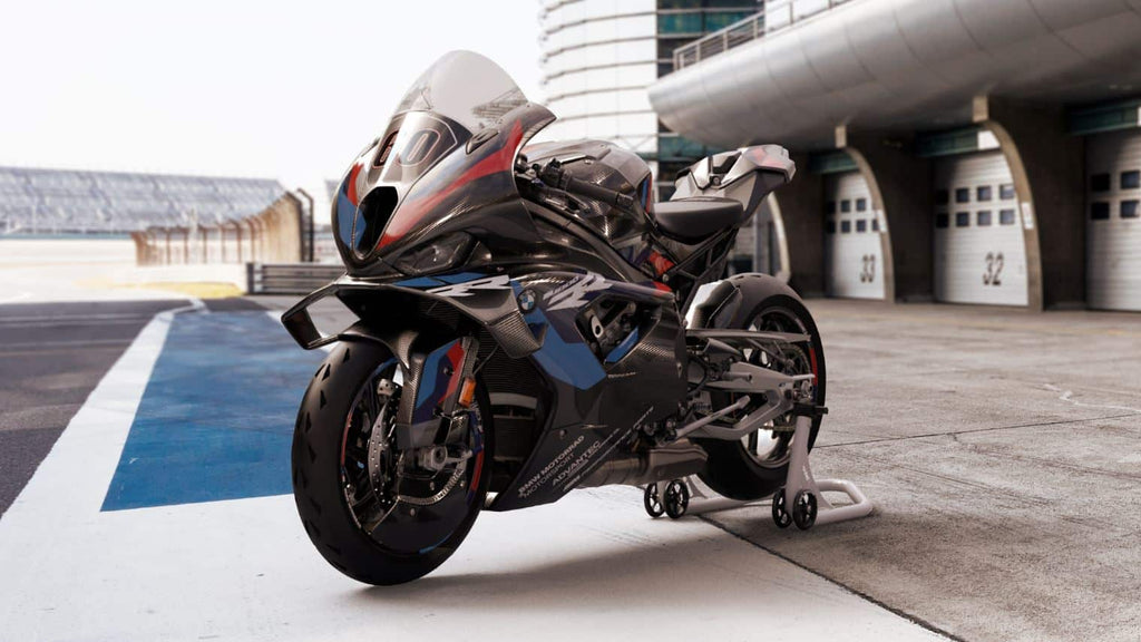 Motorcycle on a track with a modern building in the background