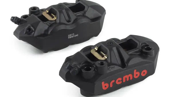 Two black brake calipers with 'brembo' branding on a white background