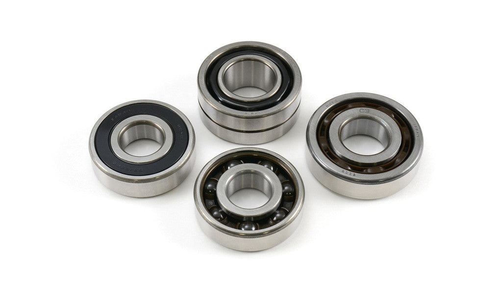Four metal bearings on a white background