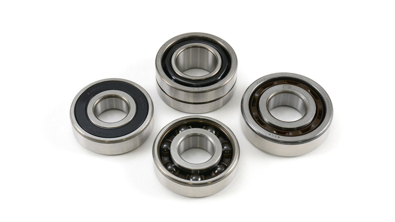 Four metal bearings on a white background