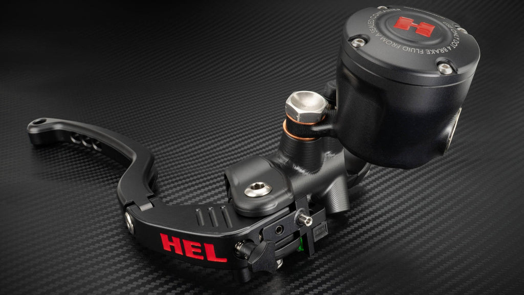 Black motorcycle clutch lever with 'HEL' branding on a carbon fiber background